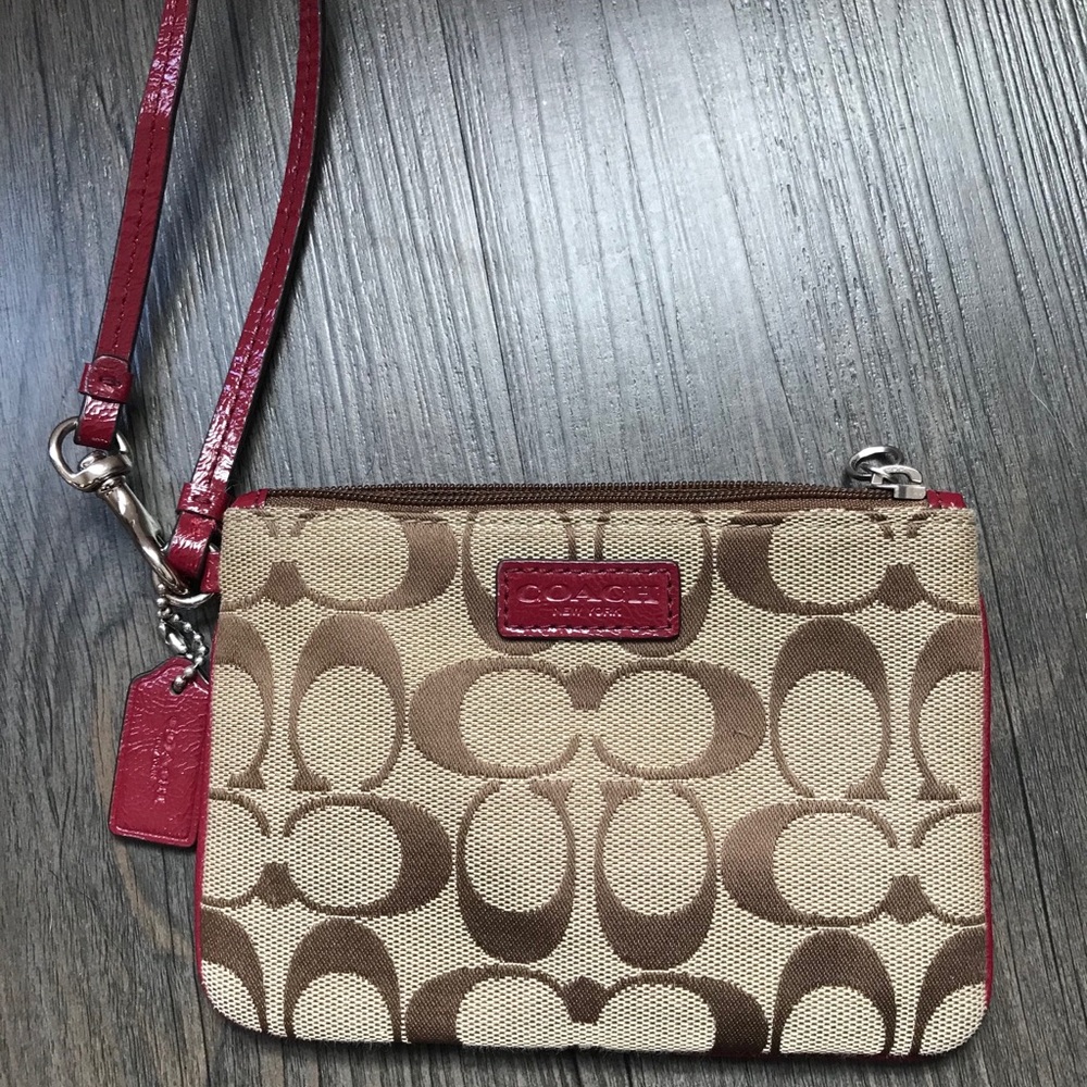 Coach wristlet with crimson accents